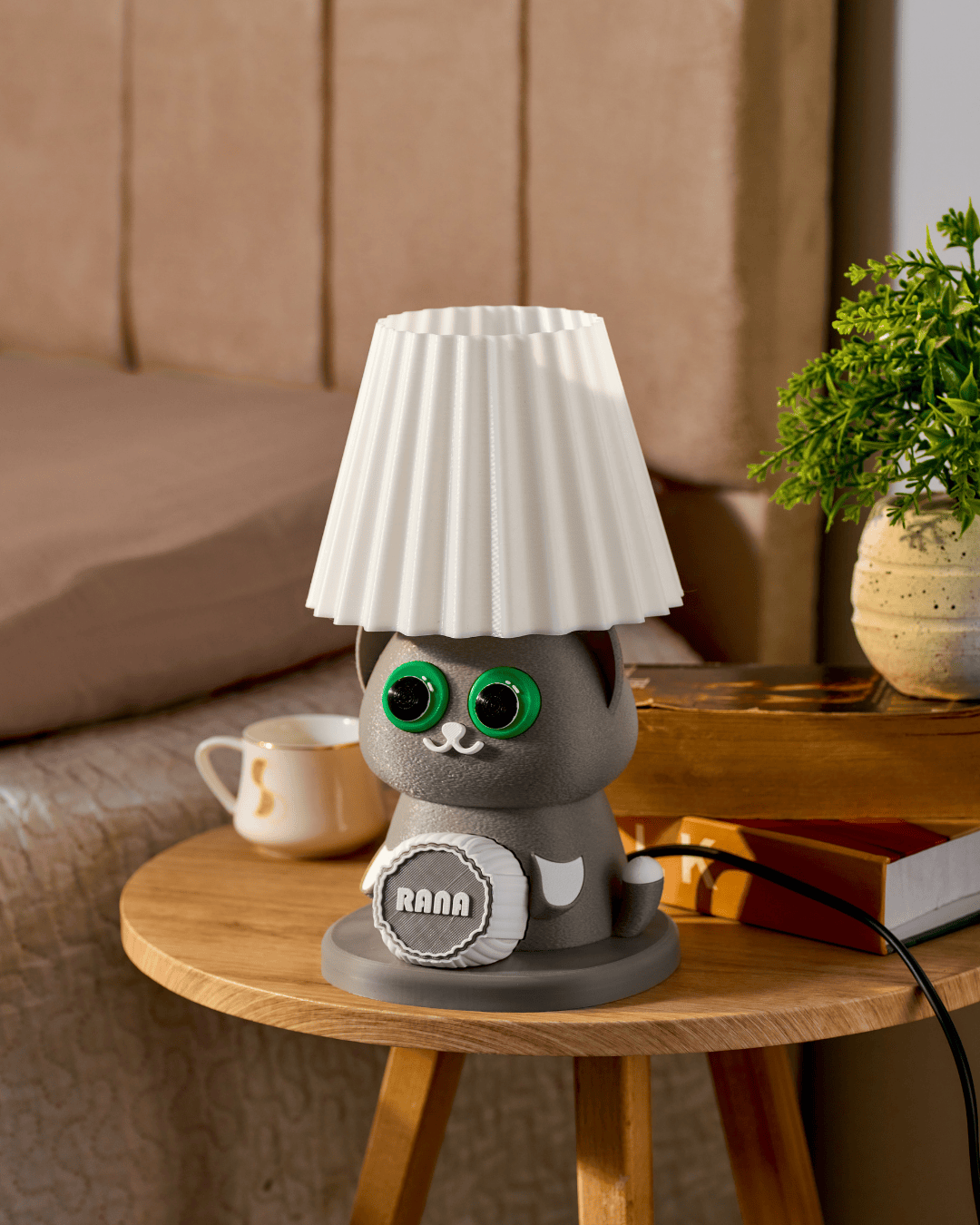 Cat-shaped lamp with a white lampshade on a wooden table.